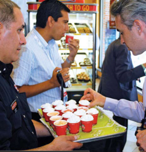 Picture of people sampling a product.